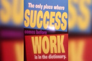 A poster with the words " success comes before work is in the dictionary ".